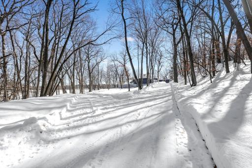 This rare 10+ acre plot of land features a range of usable elevations with incredible views, more than 1,000' of waterfront, a private beach & lagoon for fishing, multiple patio spaces and a limestone road to transport you to it all by ATV.