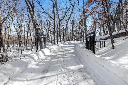 The private driveway features gated entry.