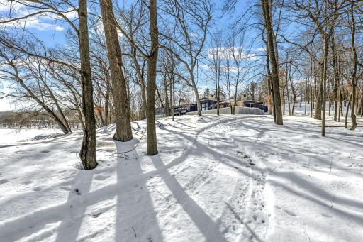 This rare 10+ acre plot of land features a range of usable elevations with incredible views, more than 1,000' of waterfront, a private beach & lagoon for fishing, multiple patio spaces and a limestone road to transport you to it all by ATV.