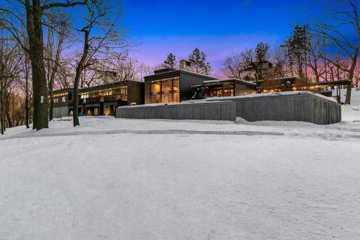 This recently restored, Frank Lloyd Wright inspired, mid-century modern masterfully integrates with its 10+ acre setting along the shores of a private, recreational lake (known for its privacy and great fishing).
