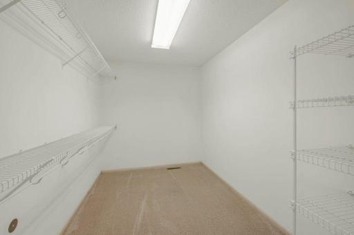 Large Primary Walk in Closet - Can you Imagine bringing California Closets into this?!