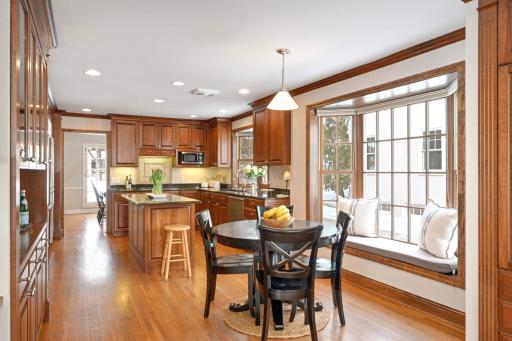 Spaciuos informal dining area with a large bay window