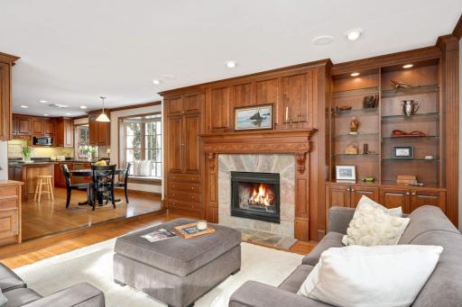 Stunning wall of cherry built-ins & wood burning fireplace