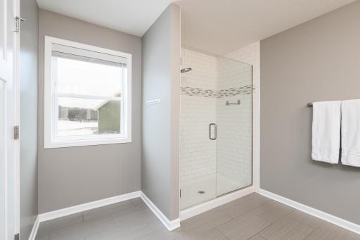 Primary en-suite shower with tile surround!