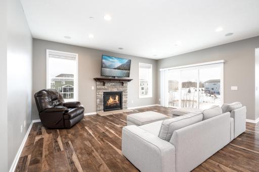 Great room with gas fireplace and plenty of natural light!