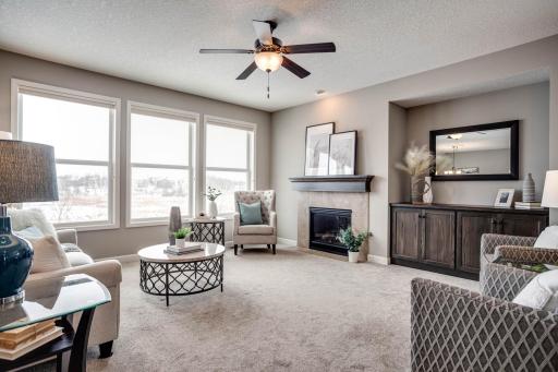 Thoughtfully designed with a heightened attention to detail, many of the home's interior gathering areas overlook the private wetland views as well, including the lovely great room with gas fireplace and rich, espresso stained built-ins.