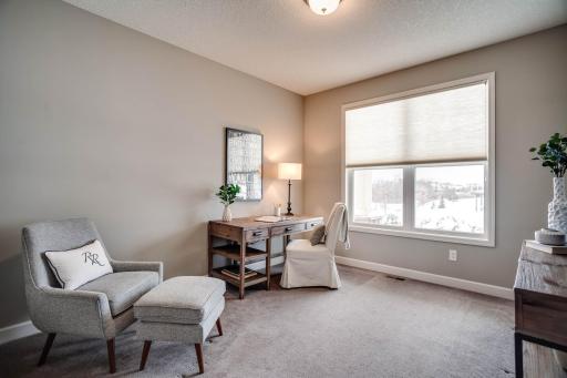 An added perk, the main level also includes a 2nd fabulous bedroom/office which is located at the front of the home and features a glass French door entry.