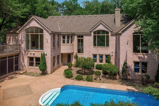 .83 Acre Offering Privacy Surrounded by Mature Trees, Backing to Pond with Fountain