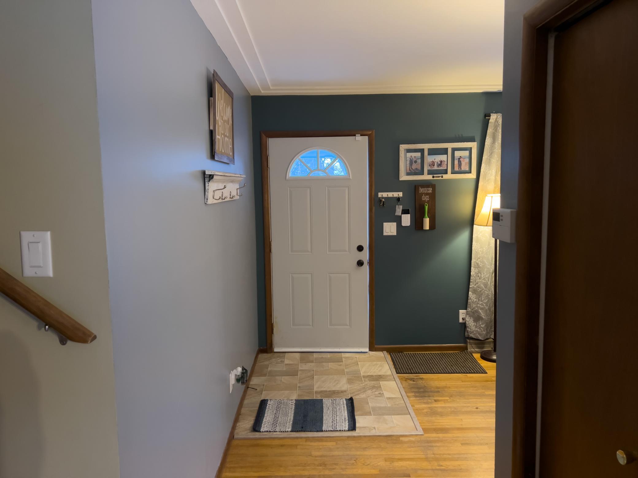 View of front entry and a sliver of the living room.