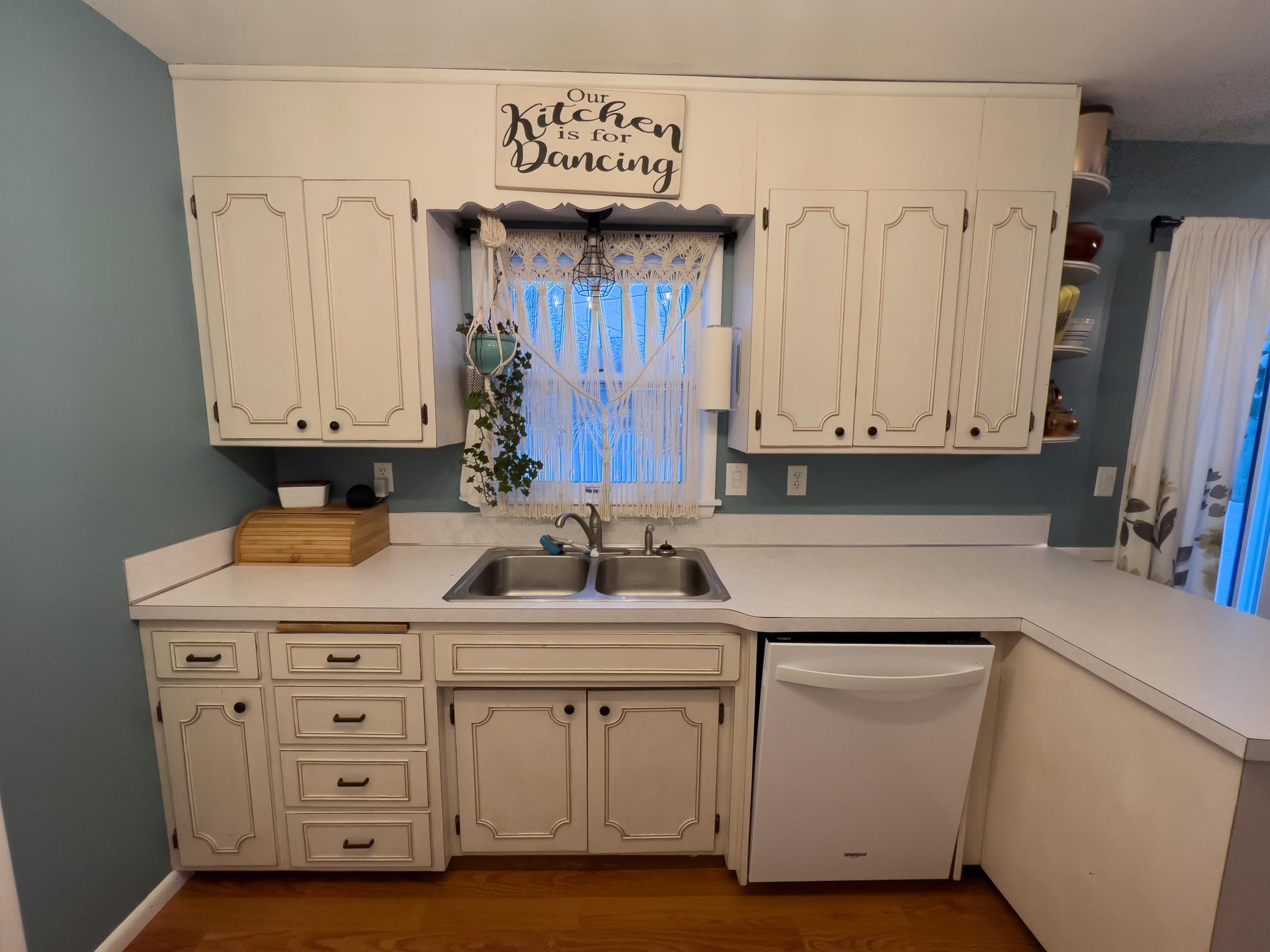 View of kitchen and window.