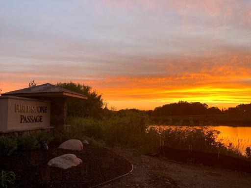 Sunset view from our entrance monument over the pond to Fieldstone Elementary School.