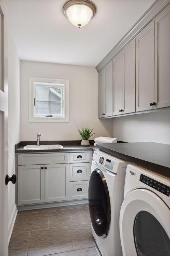 The laundry room is conveniently located on the upper level adjacent to the bedrooms.