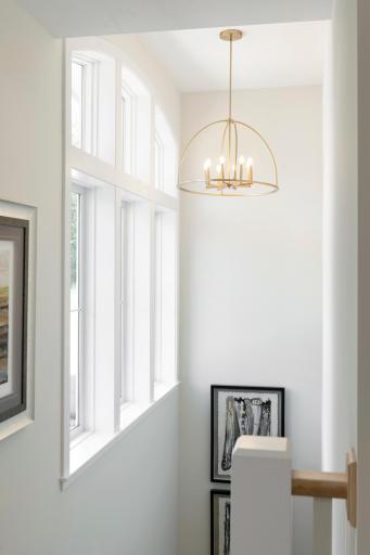 Front elevation windows and open stairwell provide tons of curb appeal and initial wow factor