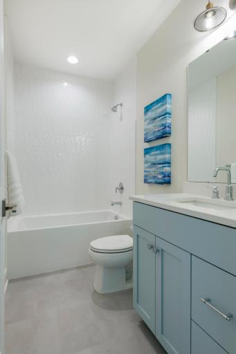 Fully tiled tub walls make this lower level bath a showstopper