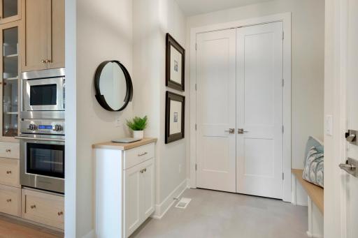 Mudroom storage paired with LVP flooring makes for easy organization and cleaning