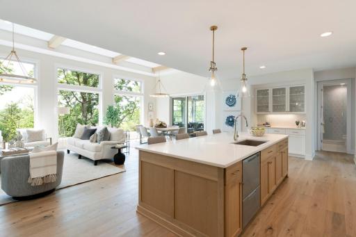Drop your belongings at the custom bench or drop cabinet at the mudroom before entering the kitchen space