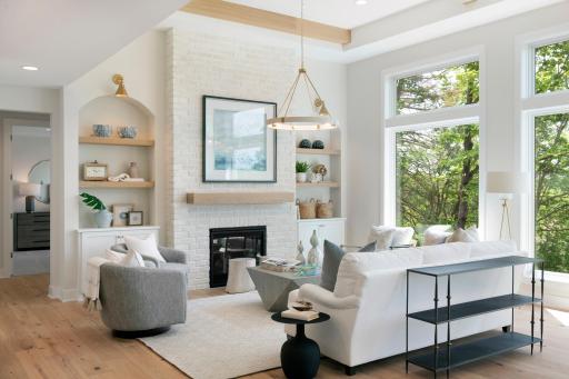 Gas fireplace with brick surround to the 12' ceiling with
