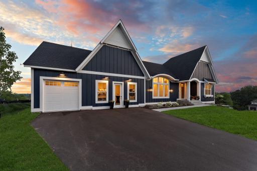 Front elevation includes 3-stall garage (sales center to be converted to double stall)