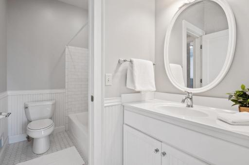 Jack & Jill bathroom with separate sinks & pocket door to maximize use of space