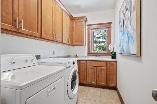 Main floor laundry that isn't lacking for storage! Wow!