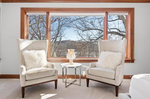 Experience a view like no other off the master suite that overlooks a wooded backyard & pond