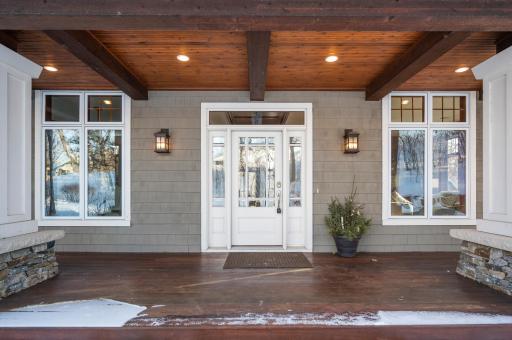 Huge inviting front porch welcomes your guests