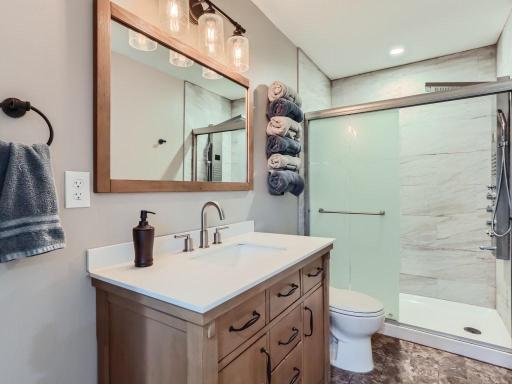 The lower level 3/4 bathroom has beautiful finishes and a walk-in shower.