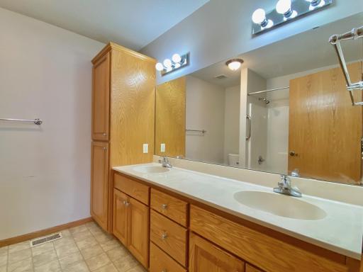 Lots of storage in the owners bath and double sinks for convenience.