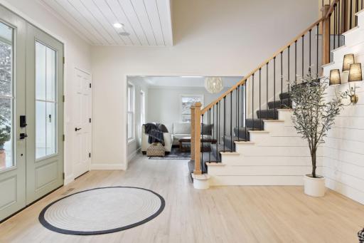 Entry with custom ceiling, Double Coat Closets leading into Family Piano Room