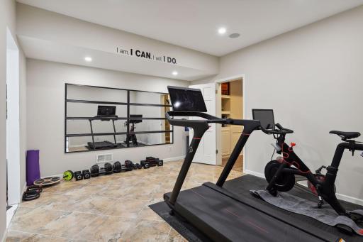 Exercise room with side area for storage or wine room