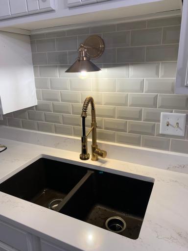 Quartz counter, tile backsplash, new lighting and faucet