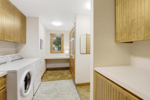 Main floor tiled laundry room with access to one of 2 double garages.