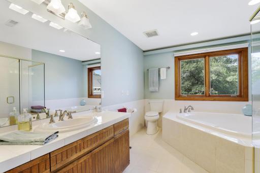 Spa tub and separate shower in owners bath.