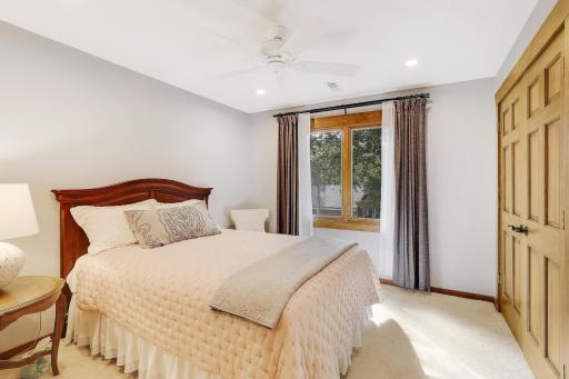 2nd bedroom on upper level with ceiling fan.