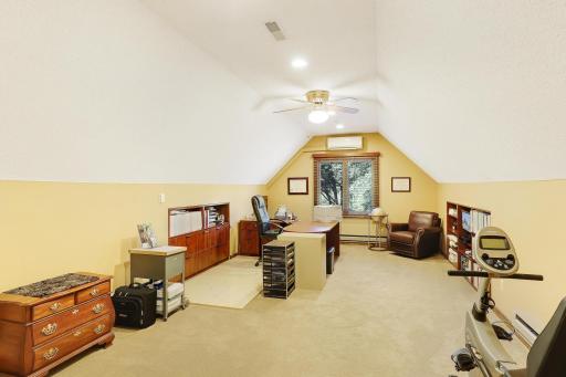 Huge vaulted office area with staircase down to garage. Addtional split heat & air source.