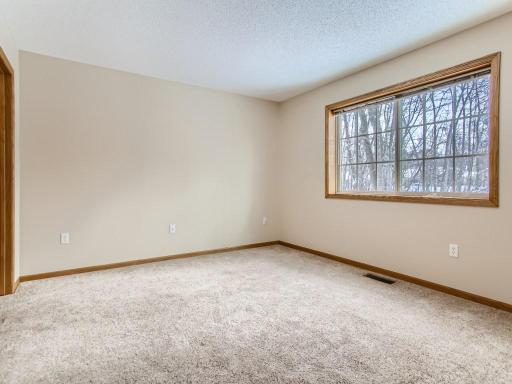 Photo for 10791 Woodland Drive, Chisago City, MN 55013 - Listing #6327572 The large primary bedroom has beautiful views of the private backyard.