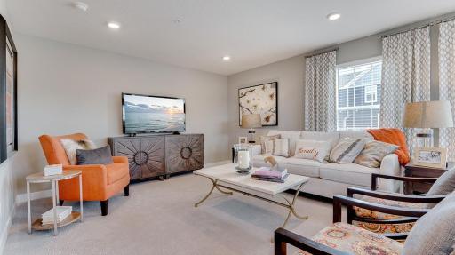 Spacious and well lit, the main floor family is great for hang outs or just to relax. Step out from here to enjoy an evening on your deck, or bring the party outdoors. Model shown. Colors and finishes may vary.