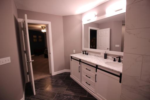 Master bath is all new. Beautiful double sink vanity with marble top and under mount sinks. Large tiled floor.