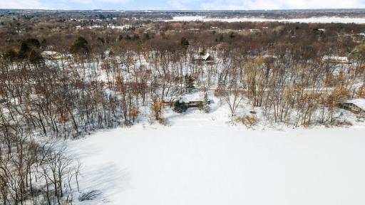 Aerial View of 38 E Oaks nestled into the trees with 3.7 acres of land