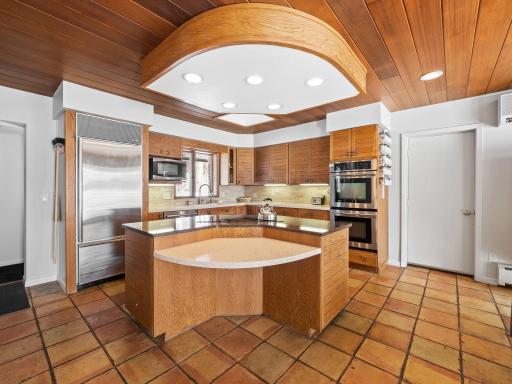 Kitchen highlights include a SubZero Refrigerator, skylight and wall oven