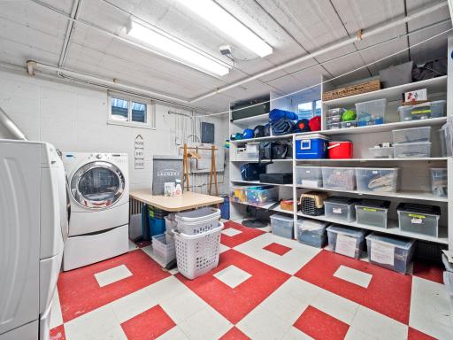 Large laundry room with many shelves for storage or hobby space. Updated electrical panel 2023.