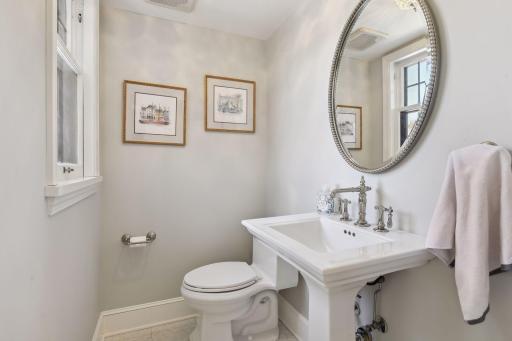 A main level powder room is perfectly positioned off of the kitchen