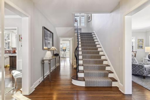 A center hall design allows for site lines and you can see the lake as you glance to the back family room.