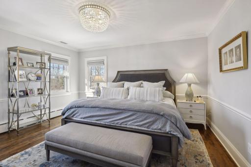 The master suite is quite expansive. This king bed leaves an extraordinary amount of space for other furniture pieces