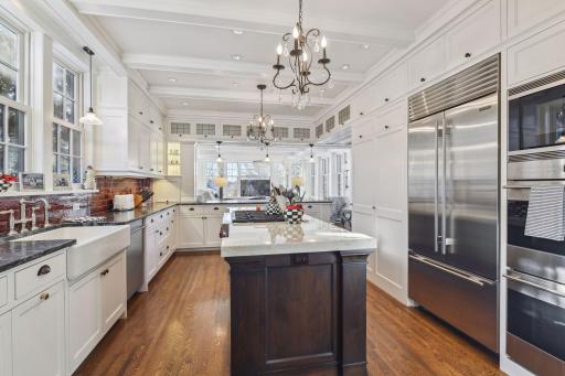 A center island design truly creates a chef's dream space and yes, this is an eat in kitchen. That back counter serves as a second island with seating for 4 up to 5 comfortably.