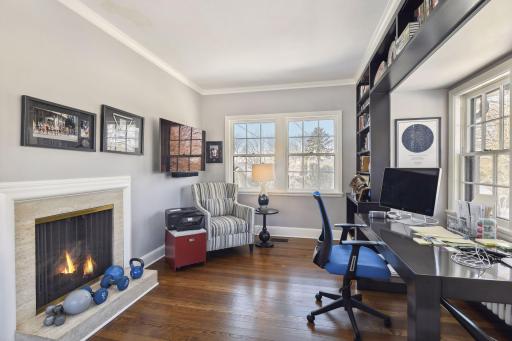 The two sided fireplace creates a perfect spot for the den/office. This family uses this space as an office.