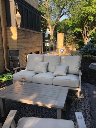 A charming patio off of the side entry on the main level off the family room leads to this!