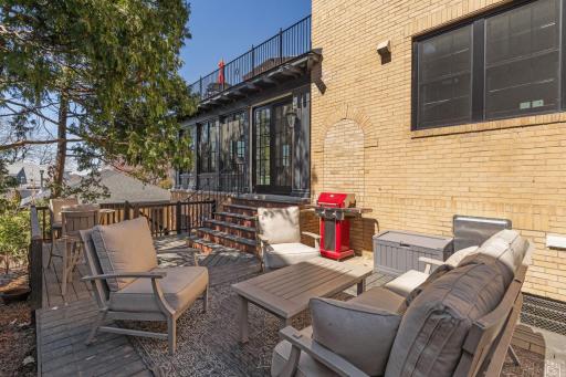 The side patio off of the main floor family room is enjoyed throughout the summer.