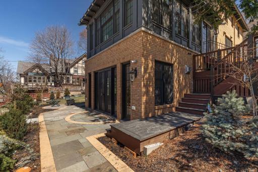 This gorgeous new blue stone tile patio was completed on the lower walkout and the same stone was used throughout the entire property on all of the new hardscape.