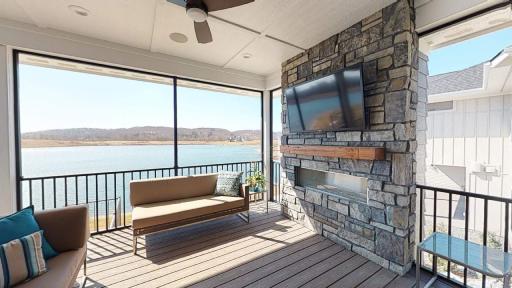 Relax On The Screened In Porch with TV & Fireplace